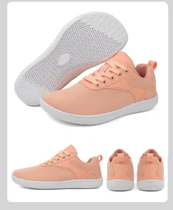 Detailed view of salmon pink breathable knit barefoot shoes with non-slip rubber soles