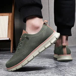 Close-up of olive green breathable knit casual men shoes with thick cushioned sole