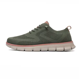 Close-up of dark green breathable knit mesh fabric and textured rubber sole on loafer