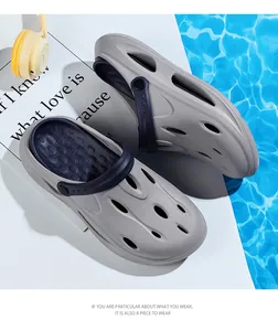Top view of breathable grey foam clogs with blue heel strap and non-slip massage texture