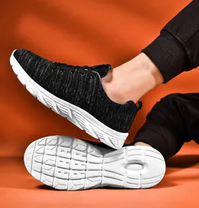 Detail of breathable black knit mesh upper and white non-slip thick sole on retro shoes
