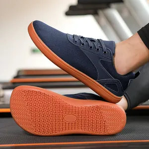 Detail of dark blue barefoot sports shoes showing breathable mesh and rubber grip soles