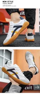 Dettaglio di sneaker rétro con mesh traspirante, pelle scamosciata e suola in gomma