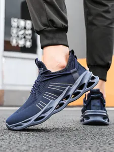 Detail view of breathable knit running shoe featuring a unique hollow blade outsole design