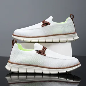 White breathable knit slip-on loafers for men with brown leather trim and thick soles