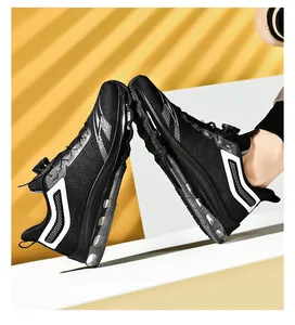 Detail of men's black running shoes showing the rotating buckle and full-length air cushion