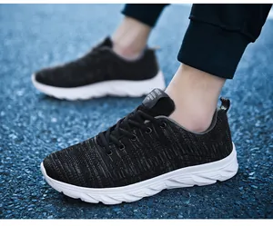 Close-up of breathable black flyknit mesh and textured side stripes on men's running shoe
