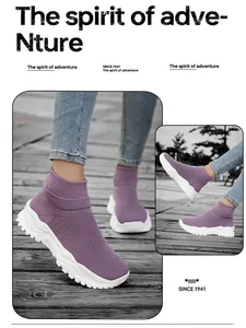 Detail of purple knitted athletic sock shoe with thick cushioned sole on wooden deck