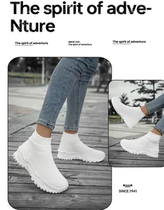 Detailed view of white high-top flyknit sneakers featuring thick non-slip soles in outdoor use