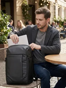 Business laptop backpack with Mark Ryden logo in a professional outdoor setting