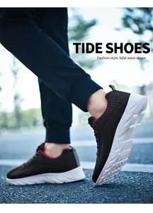 Detail view of lightweight knit sneakers with black mesh and red stitch on white sole