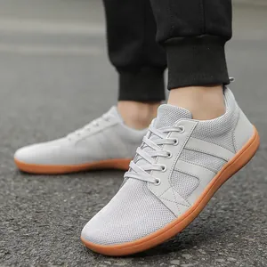 Men's light grey breathable knit sneakers with durable gum rubber sole for daily outdoor wear