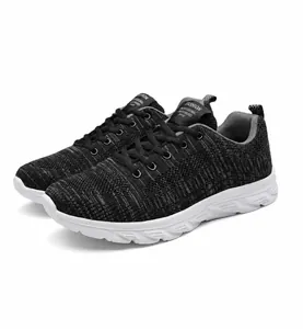 Close-up of black gray breathable mesh knit sneakers with detailed texture and laces