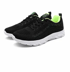 Side view of lightweight black knit breathable running shoes with neon green accents