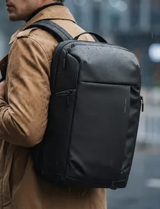 Detailed view of waterproof business backpack fabric with water droplets on black surface