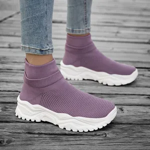 Purple high-top knit sock sneakers with thick white platform soles and stylish serrated grip