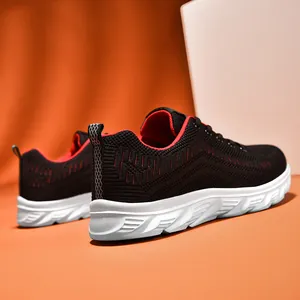 Detail view of breathable black mesh running shoes with red interior and anti-slip sole