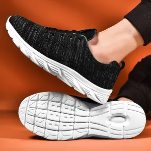 Detail shot of breathable fly-knit running shoes with non-slip thick white soles