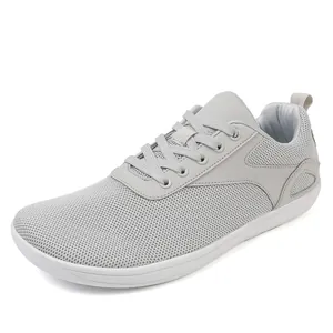 Light grey wide-width flyknit walking shoes with breathable mesh and white sole