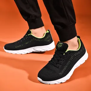 Men's breathable mesh running sneakers in black and green with cushioned sole