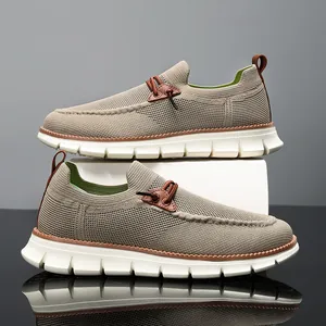 Detail of breathable fly-knit men's loafers with thick anti-slip white rubber soles