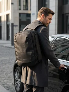 Large capacity black water-resistant business backpack for commuting and travel