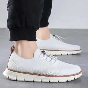 Detail showing the white breathable mesh fabric and elastic laces with metal buckle