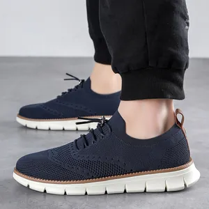 Side view of men's navy blue breathable knit loafers with white non-slip thick soles