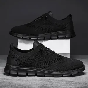 Detail of black flyknit loafers with brogue leather accents and non-slip rubber sole