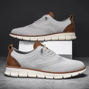 Light gray breathable knitted men's loafers with brogue leather accents and white thick soles