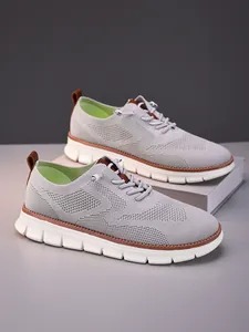 Close-up of lightweight grey breathable flyknit men's loafers with a thick white sole