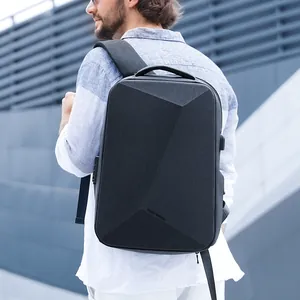 Waterproof black hardshell business laptop backpack with USB charging port and geometric design