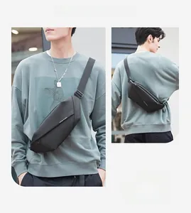 Front and back views of a black geometric chest bag with adjustable nylon straps