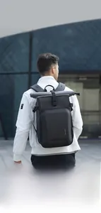 Waterproof roll-top camera backpack in matte black finish for urban professional photographers