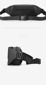 Detailed back view of a black waterproof crossbody bag featuring a breathable mesh panel