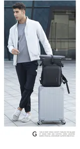 Waterproof camera backpack mounted on a rolling suitcase for travel and business