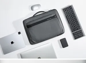 Slim grey business laptop briefcase with leather handle and front zipper pocket