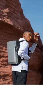 Hard shell laptop backpack featuring side anti-theft combination lock and grey finish