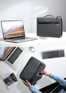Detail view of water-resistant gray laptop briefcase with front pocket and top handle