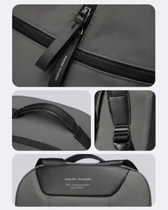 Detail view of water-resistant fabric, leather handle, and dual zippers on a gray backpack