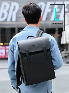 Mark Ryden Light Line matte waterproof backpack worn by model in an outdoor city setting