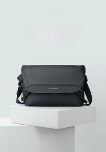 Detail of waterproof Mark Ryden crossbody bag with buckle and brand logo on urban messenger strap