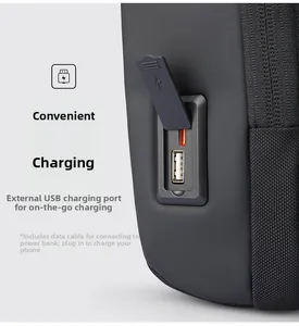 Detail of side USB-A and Type-C charging ports with dust cover on black sling bag