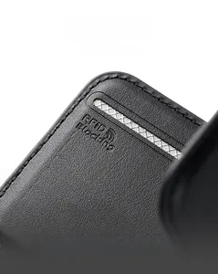 Macro view of black litchi leather texture and RFID blocking lining on slim card holder