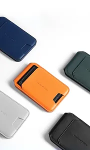 Detailed view of colorful magnetic leather card holders with lychee texture and stitching