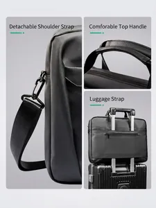 Sacoche ordinateur noire avec bandoulière amovible, poignée rembourrée et sangle valise
