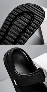 Detail of non-slip EVA sole pattern and cushioned footbed of black sport sandals