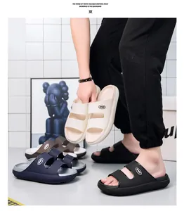 Detailed view of thick EVA slide sandals with SPORT logo and non-slip platform sole