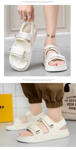 Detail of off-white sporty EVA sandals with velcro straps and anti-slip thick soles