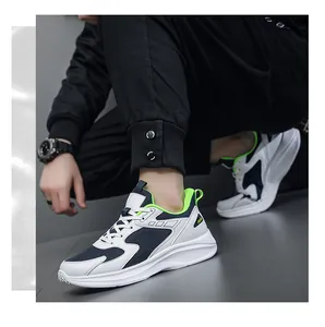 Detail view of men's breathable mesh sneakers featuring navy accents and green lining
